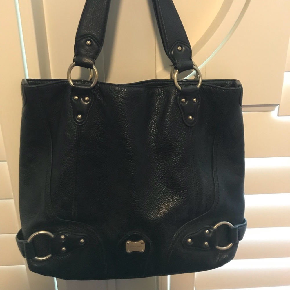 Black Michael Kors tote with gold hardware.